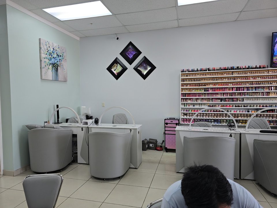 Pedicure chairs lined up in a nail salon.